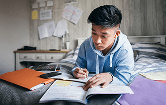 04-male-teen-doing-homework-337x214.png
