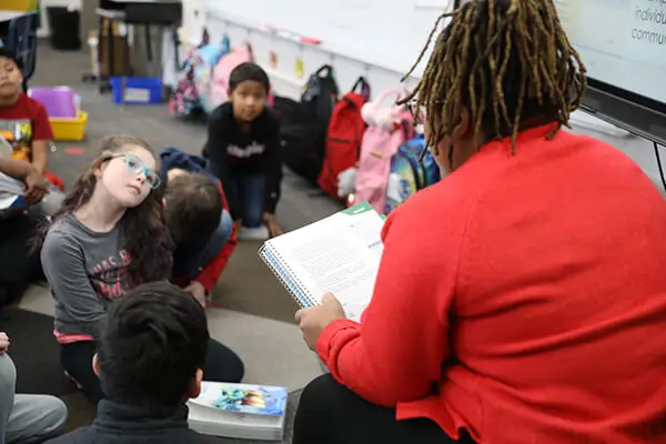 Elementary students engage in whole-class reading instruction as part of the Dalton Reads literacy initiative.