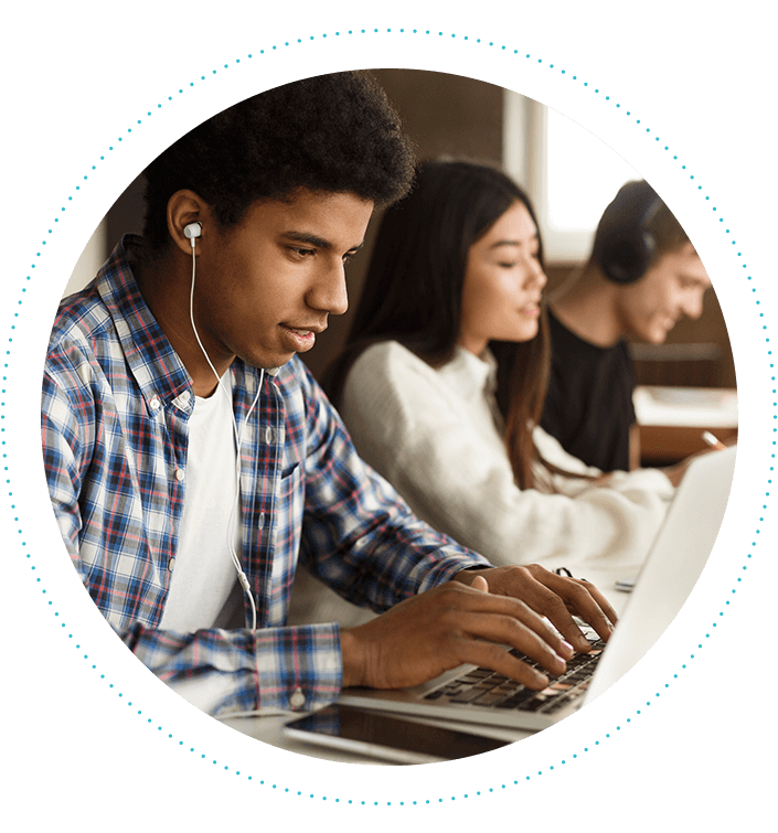faqs-male-teen-wearing-earbuds-using-laptop-705x755.png