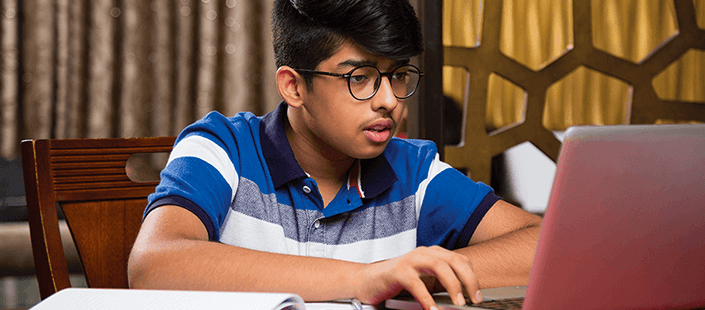 male-teen-doing-homework-on-computer-705x310.png