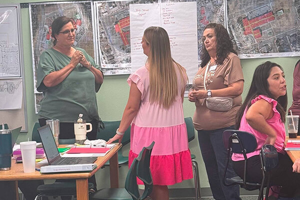 Teachers at Monahans-Wickett-Pyote ISD collaborating in a PLC session.