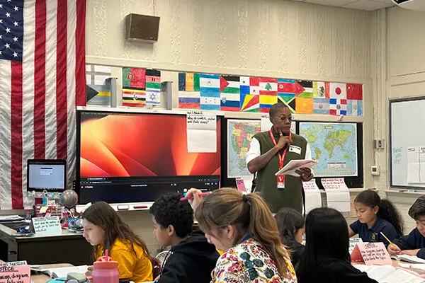 A middle school teacher teaching a literacy lesson to her students at the Anna L. Klein School in the Guttenberg School District in Guttenberg, NJ having a meeting to look at student data.