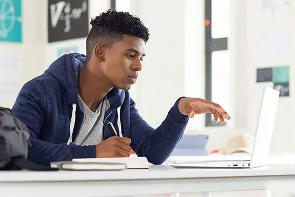 Student uses an AI-powered tool on a laptop to practice interview skills and improve professional communication.