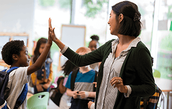 01-teacher-giving-student-a-high-five-337x214.png