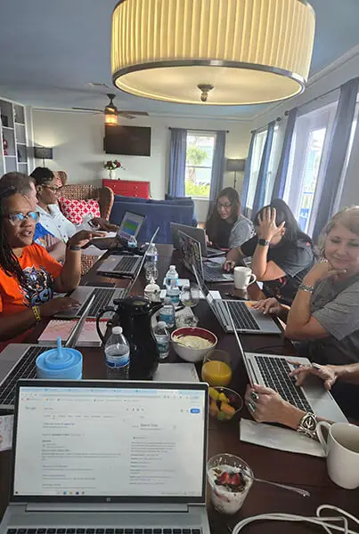 Teachers at the Susie King Taylor Community School working together in a professional learning community.