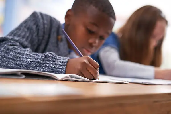 Student solving a math problem using multiple strategies to demonstrate flexible number sense and numeracy skills.