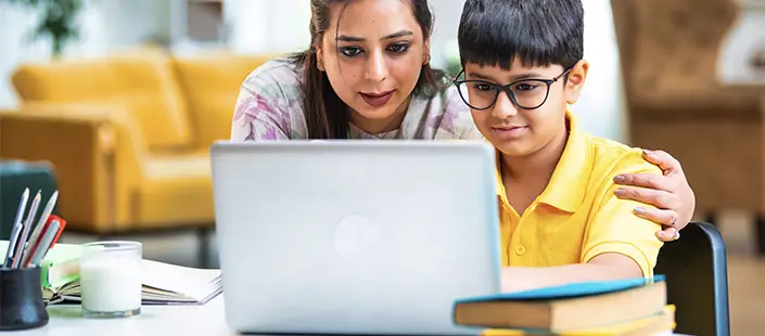 parent-with-middle-grade-age-son-learning-on-laptop-705x310.webp