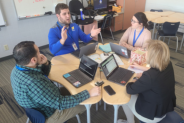 The Mukwonago High School history department gathered in a planning meeting.