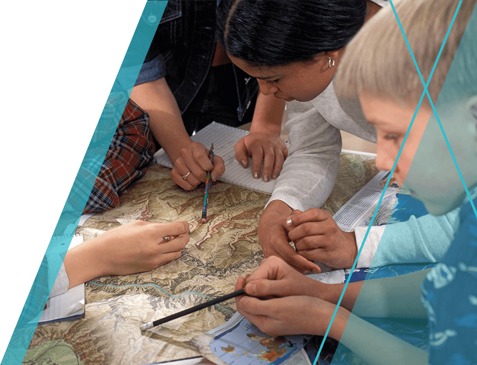 group of students studying a map