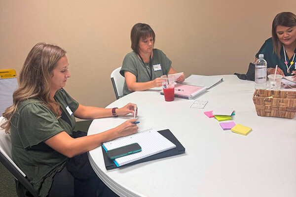 Teachers at Monahans-Wickett-Pyote ISD collaborating in a PLC session.