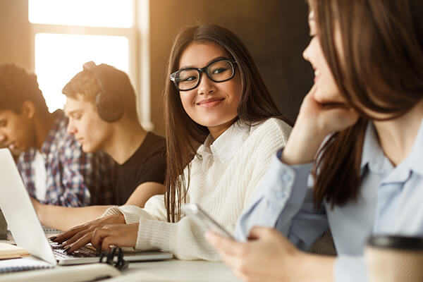 A female high school student engaged in a lesson in a Spanish class.