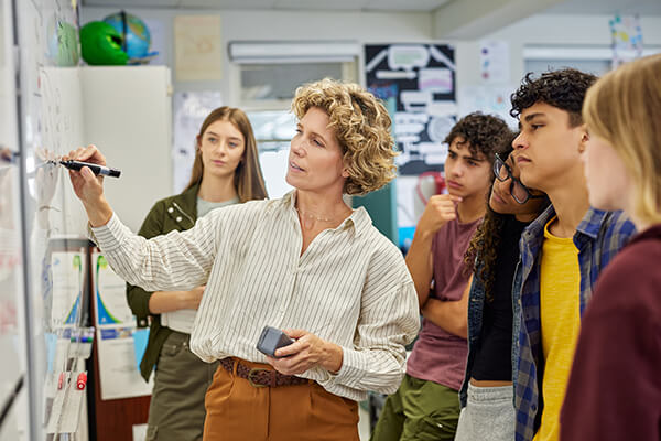 Photo of students having purposeful discussions in the classroom.
