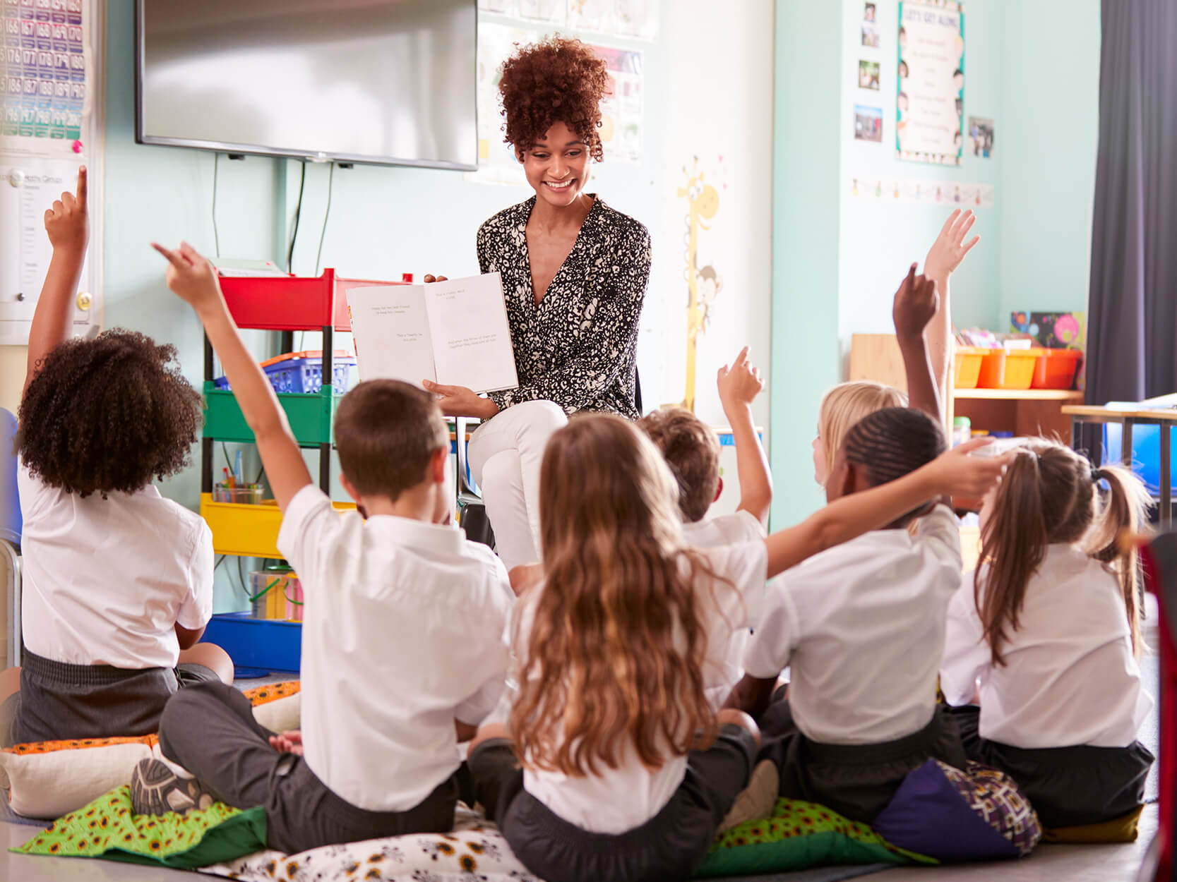 Teacher conducting an interactive read-aloud for students.