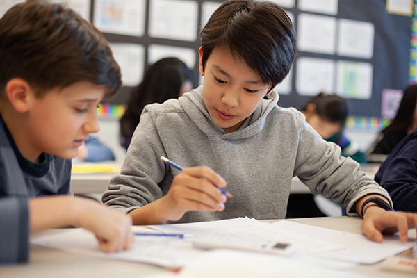 Students in a classroom practicing math fluency.