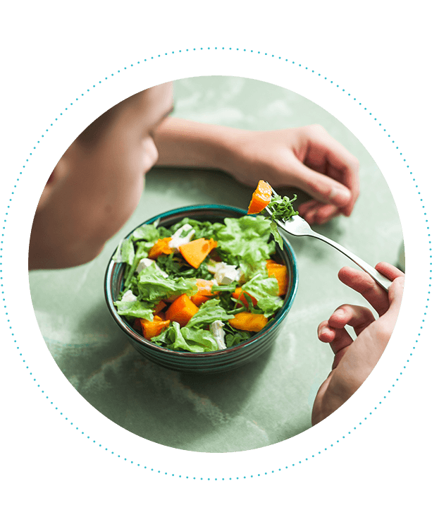 male-teen-eating-winter-vitamin-salad-613x750.png