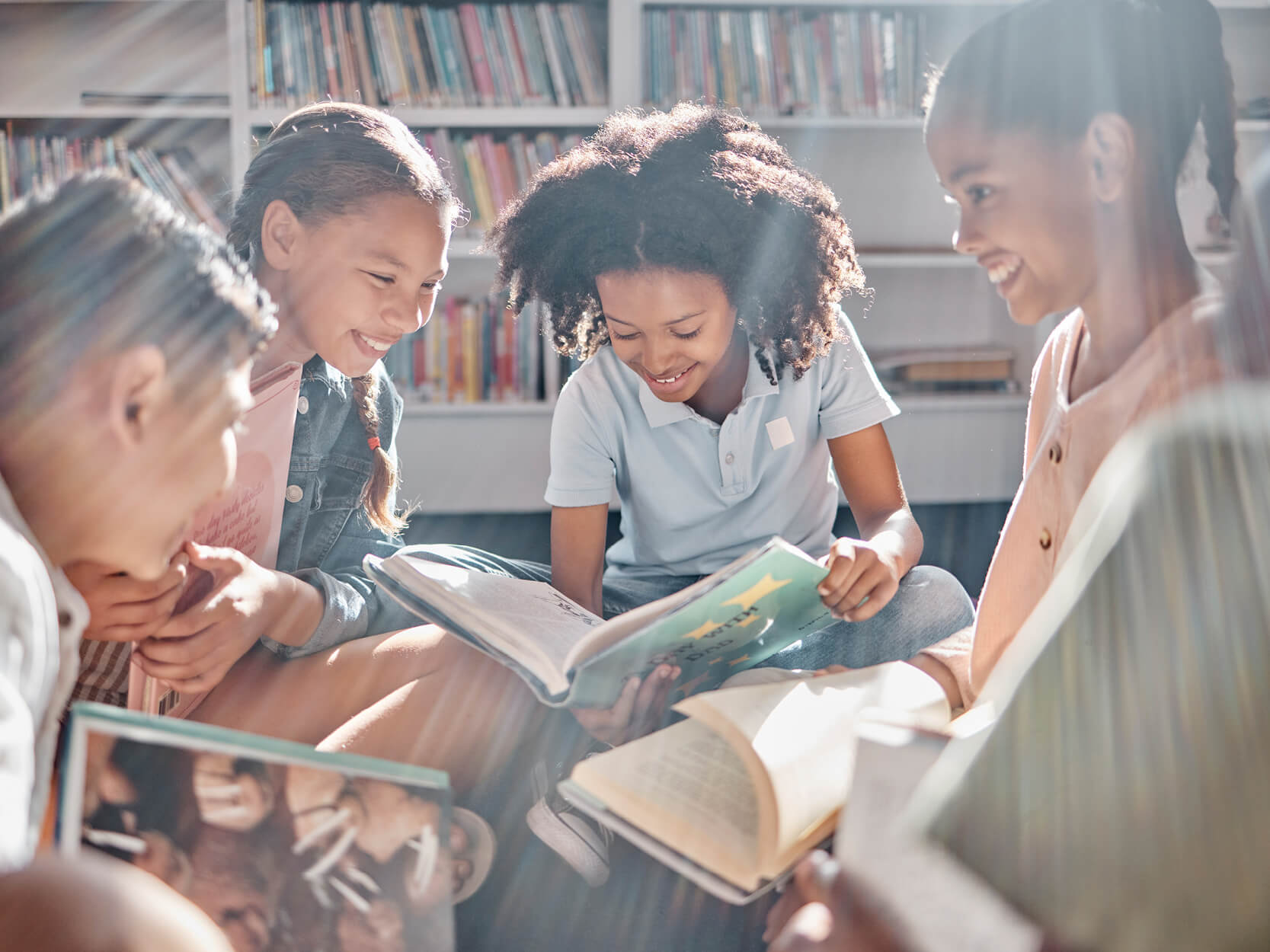 Students in upper elementary grades reading and comprehending texts.