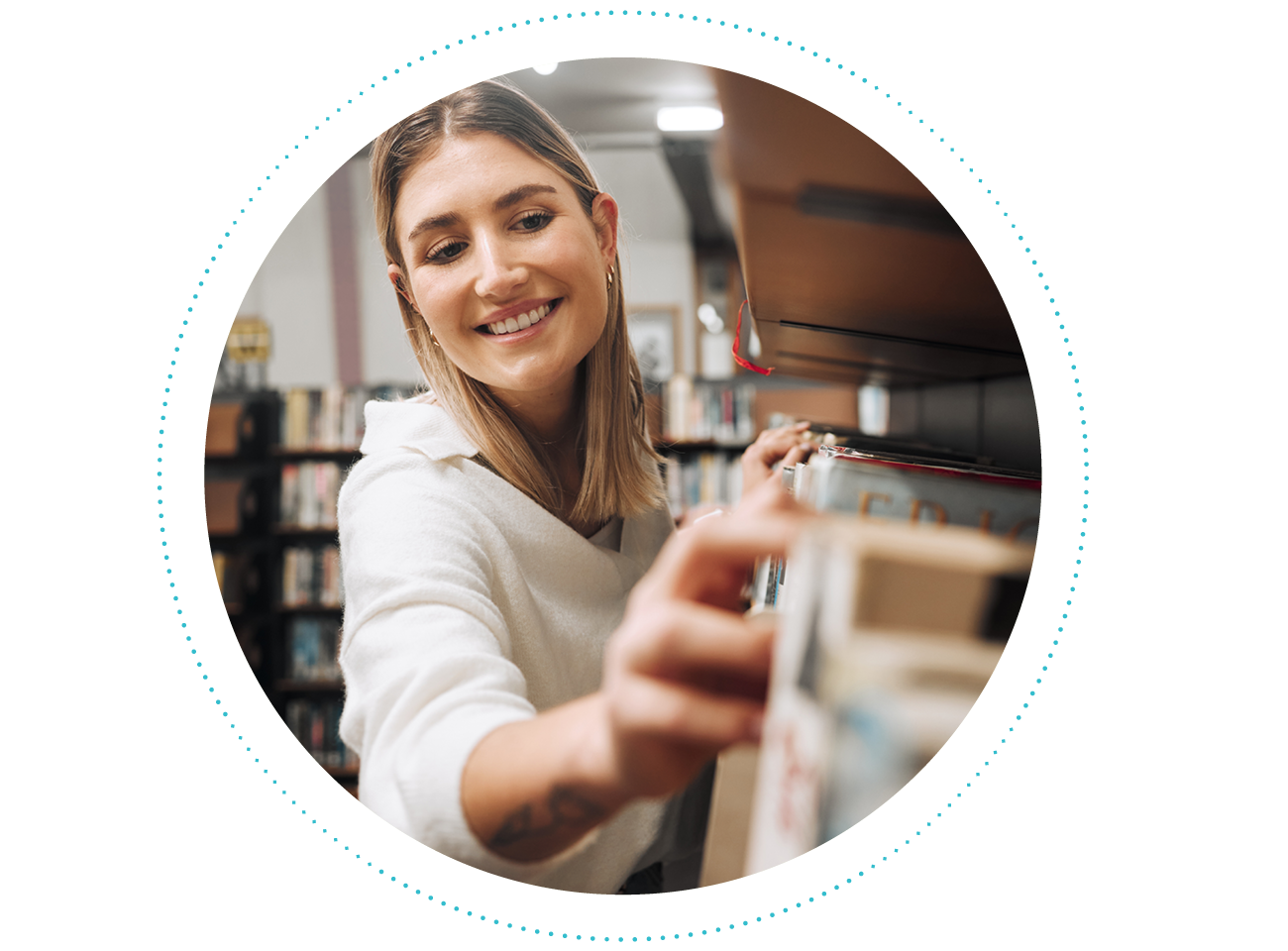 Photograph, a teacher browsing a shelf of books to learn about the Science of Reading