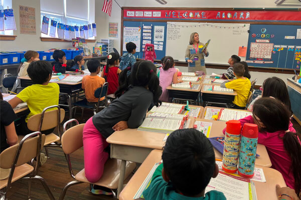 Students at the Monroe Township School District in a classroom listening to a teacher