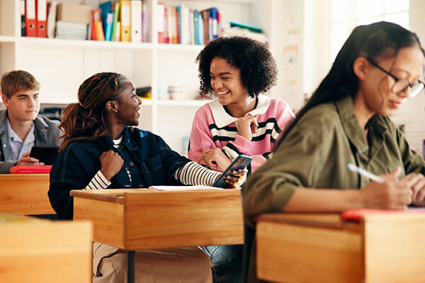Photo of students having purposeful discussions in the classroom.