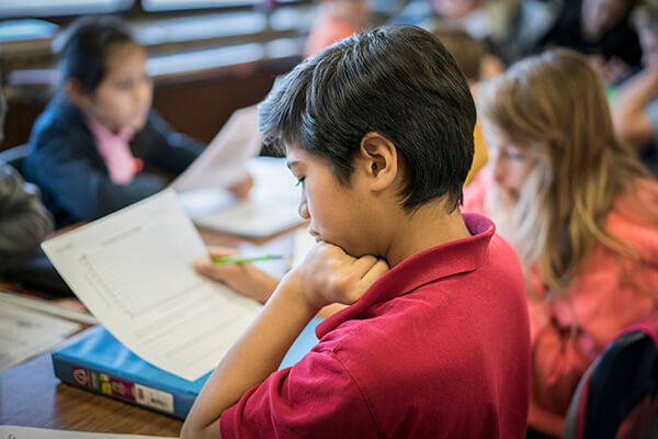 Students in a classroom practicing math fluency.