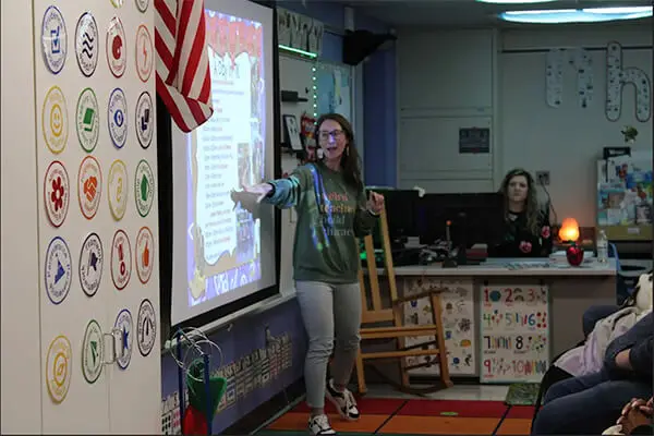 A photo of a teacher in front of a classroom teaching a literacy lesson using myView Literacy by Savvas Learning Company at Avondale School District in Auburn Hills, MI. 
