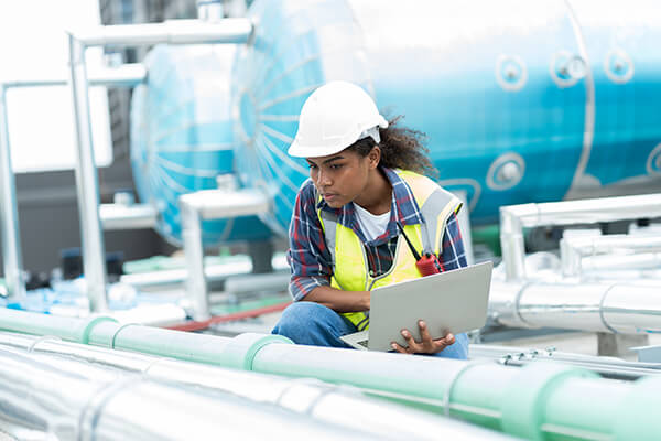 Photo of a young adult working in a STEM-based career setting.