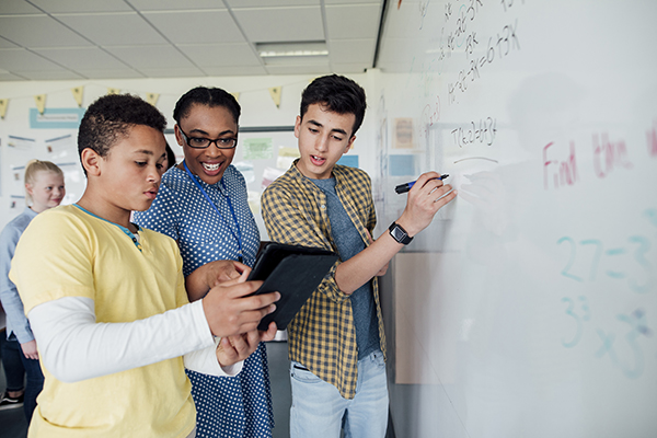  Photo of a teacher teaching math in a high school classroom