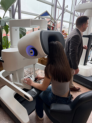 A Norwin School District student participates in a hands-on healthcare technology demonstration using a robotic surgical simulator during a workforce learning experience.