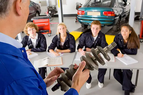 Local employer mentoring students in Career and Technical Education classroom.